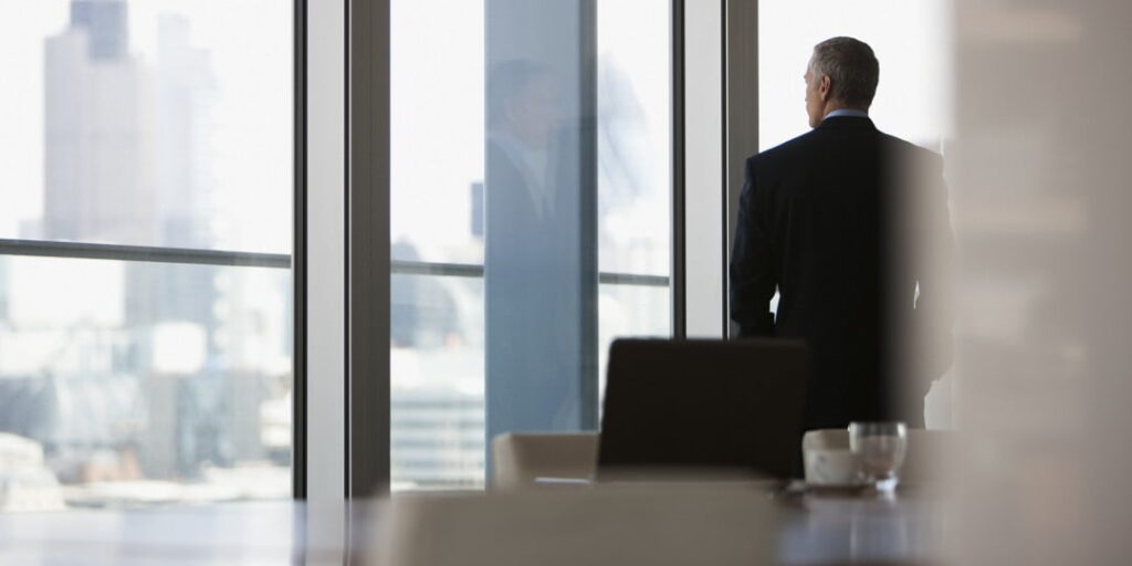 business man looking out a window