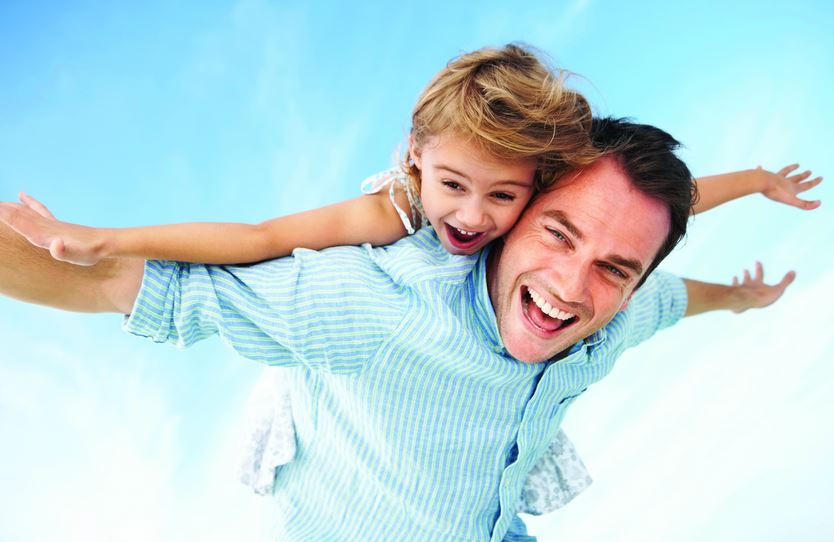 photo: man with daughter on piggyback