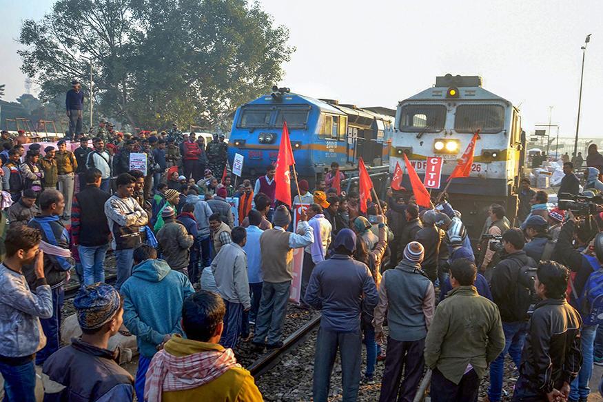 thousands people take to streets in protest, here people are blocking tainlines.