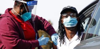 Association of SARS-CoV-2 vaccination status with risk of influenza-like illness and loss of workdays in healthcare workers